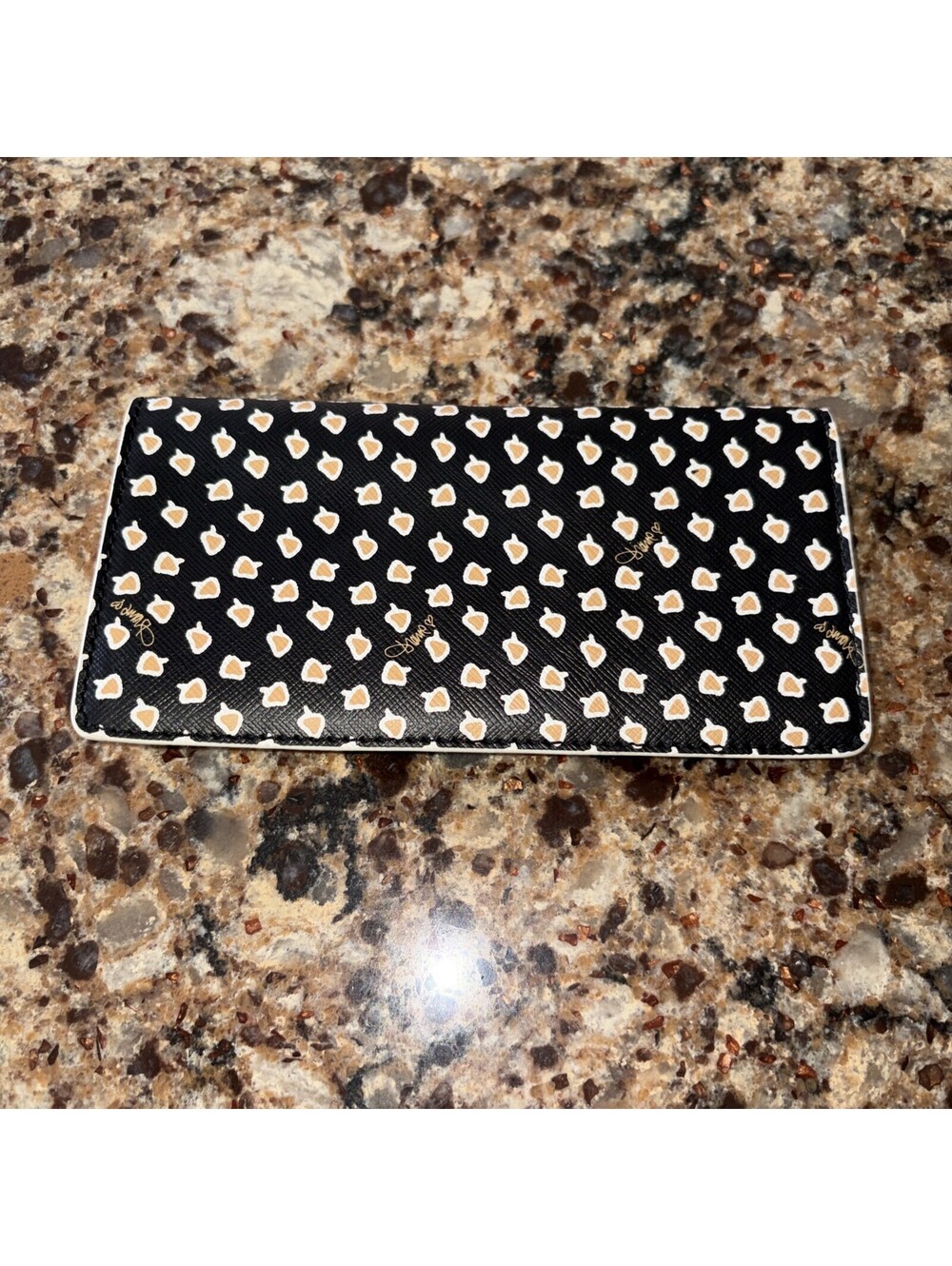 Diane von Furstenberg black wallet featuring a textured Checkbook Holder